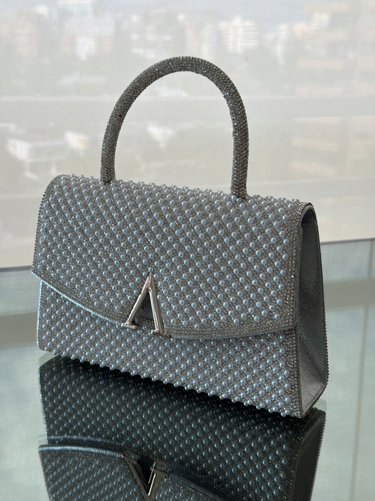 CARTERA DE FIESTA ESTELAR PLATEADA